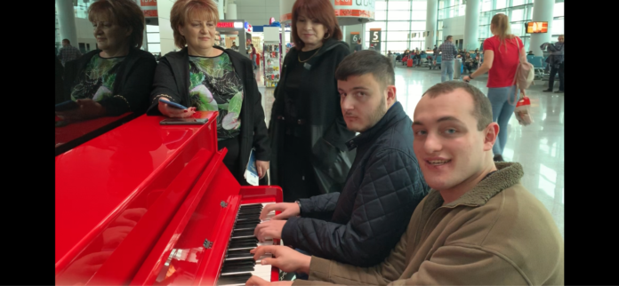 A musical-send-off-at-the-airport.-696x322